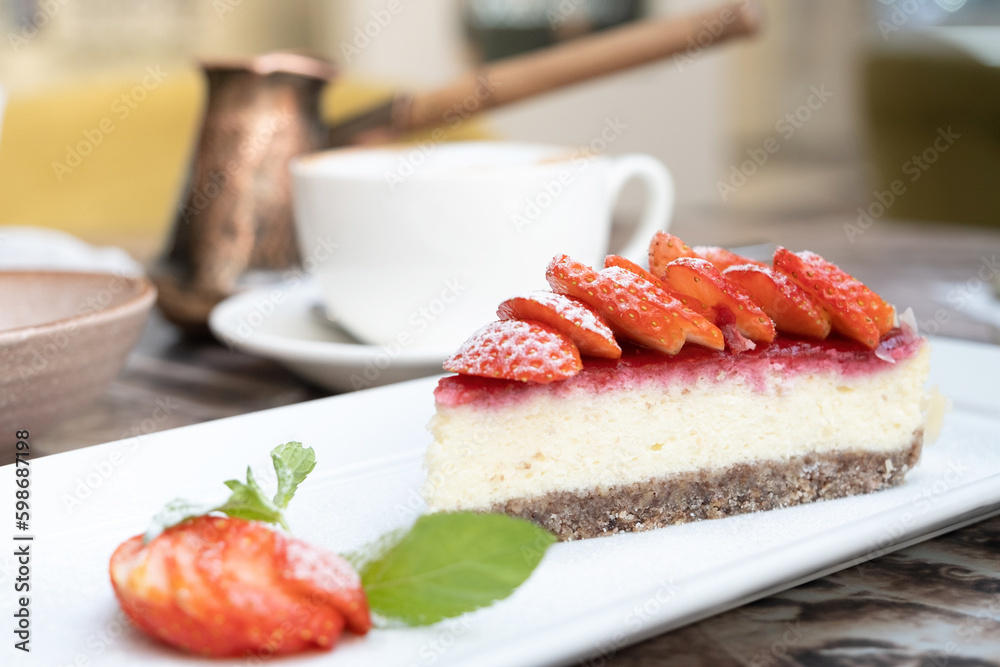 Piece of delicious cheesecake with berries on table close up Piece of delicious cheesecake with berries on table close up