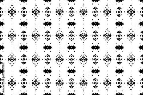 Seamless batik pattern,geometric tribal pattern,it resembles ethnic boho,aztec style,ikat style.luxury decorative fabric black and white seamless pattern for famous banners.  © Charisia