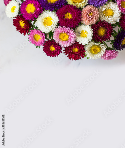 Space for text. Bouquet of small multi-colored chrysanthemums. Top view