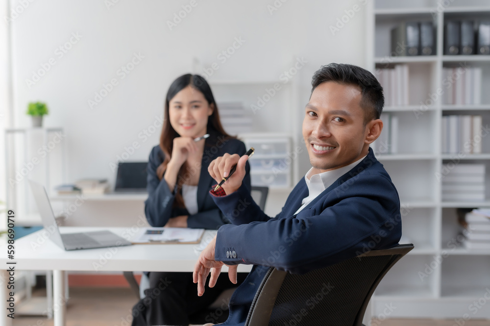 Two asian business people discuss with new startup project Idea presentation, analyze planning at office. Two asian business people discuss with new startup project Idea presentation, analyze planning at office.