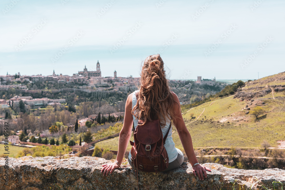 Tour tourism in Spain- woman looking at panoramic view of Sgovia cityscape