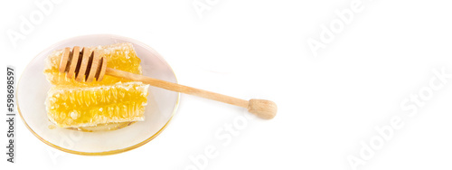 Honey in a honeycomb isolated on a white . Free space for text. Wide photo.