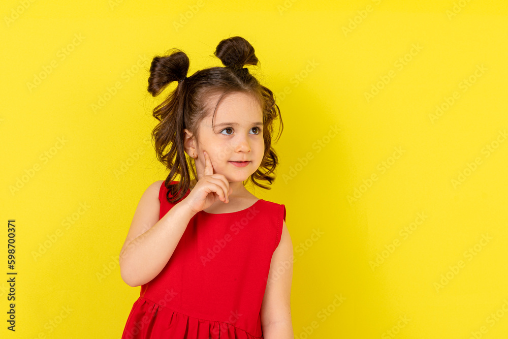 Little girl thinking on a white background. Closeup of a dreaming beautiful little girl Little girl thinking on a white background. Closeup of a dreaming beautiful little girl
