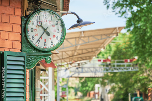 old fashioned clock on a train station platform
