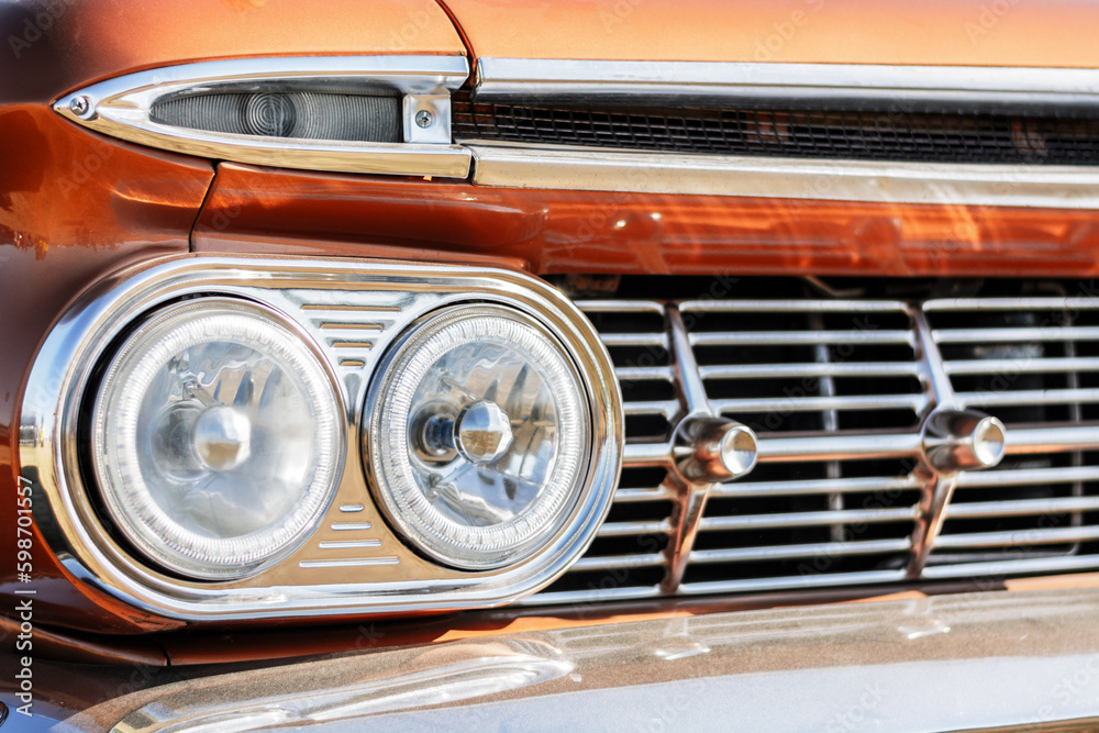 Vintage car headlight close-up. Classic car background