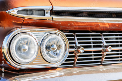 Vintage car headlight close-up. Classic car background