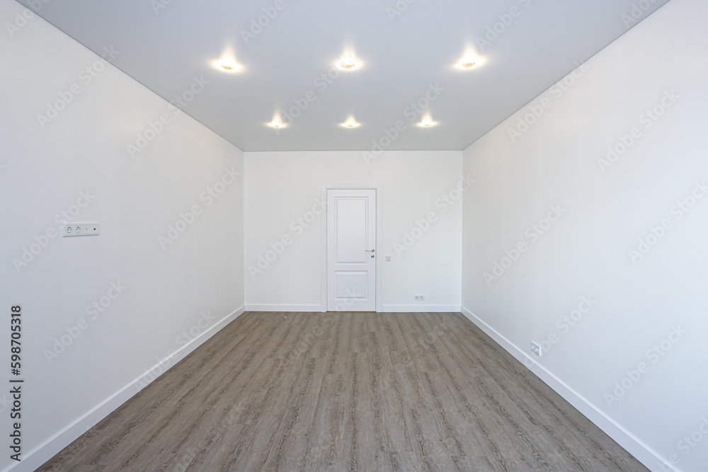 Empty room without furniture with white walls and ceiling Empty room without furniture with white walls and ceiling