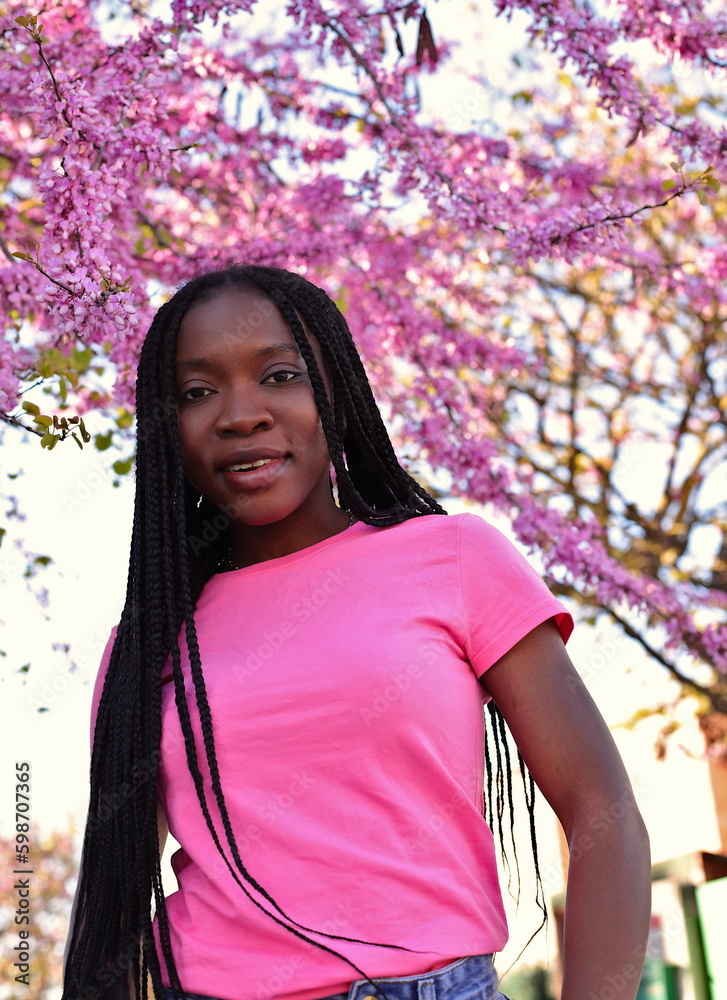 Portrait of black young woman on the street, dreadocks hairstyle Portrait of black young woman on the street, dreadocks hairstyle