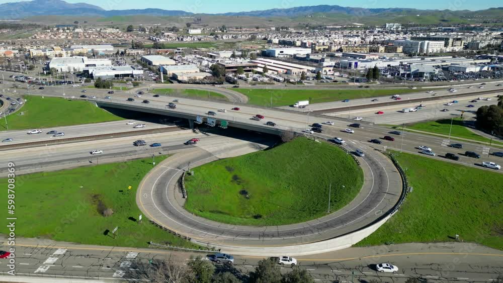 The 4k aerial view of the 580 freeway on and off ramp in Dublin ...