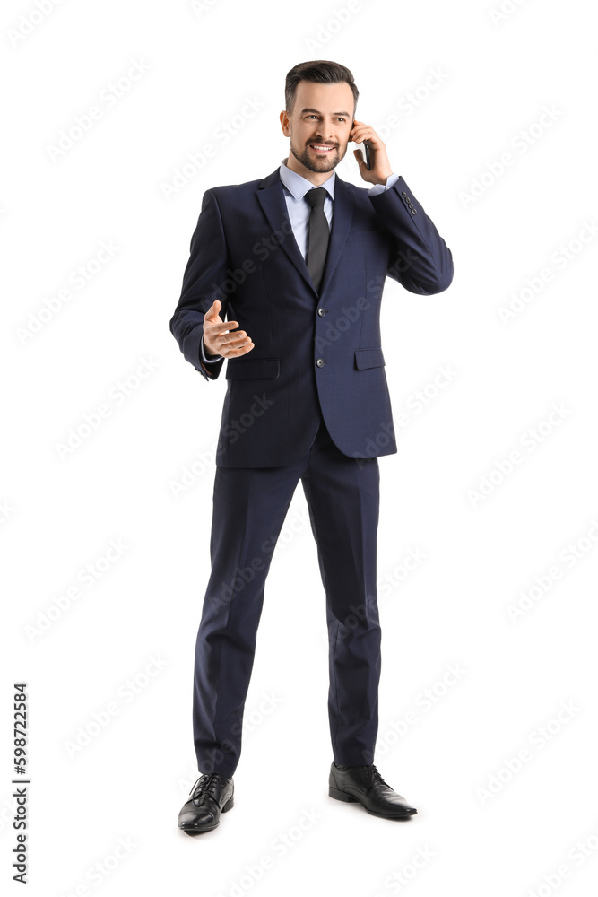 Handsome businessman talking by mobile phone on white background Handsome businessman talking by mobile phone on white background