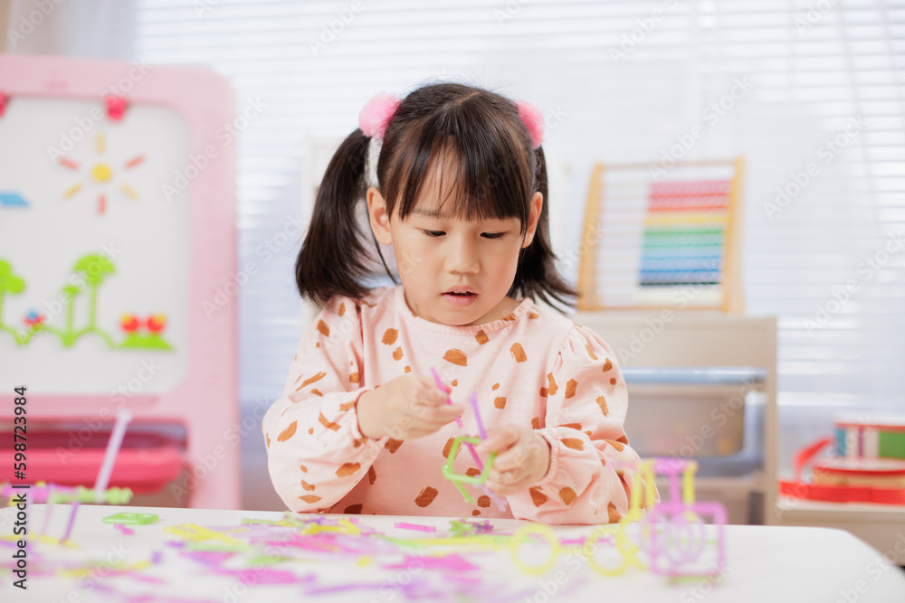 young girl was playing creative toys at home young girl was playing creative toys at home
