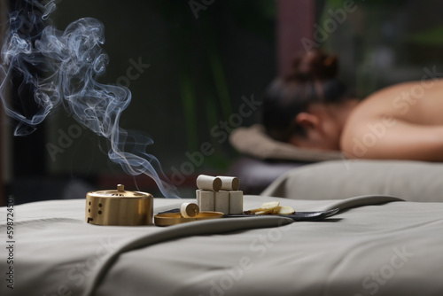 Fotografie Moxibustion treatment - traditional Chinese medicine tools for acupuncture points heating therapy