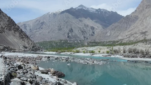 Drone flying Shyok river and towards mountains of Karakoram range from the road leading to Khaplu valley from Skardu. photo