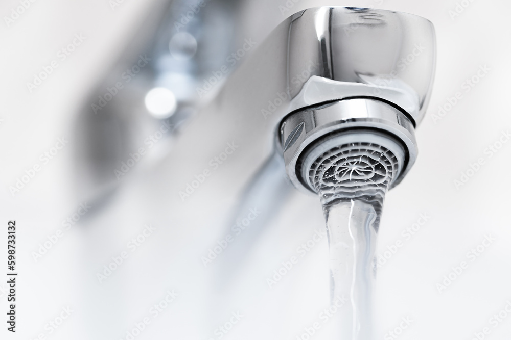 faucet with hot water jet and steam close-up faucet with hot water jet and steam close-up
