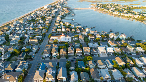 Quadro su tela Aerial view of Wrightsville Beach, NC homes during a sunrise.