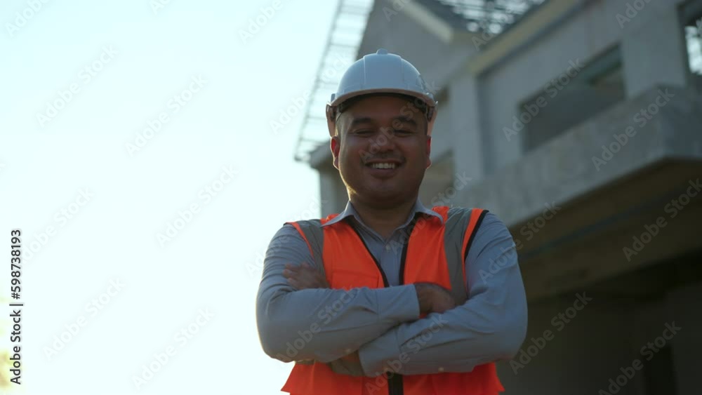 Confident asian engineer man with tablet for checking and maintenance to inspection at modern home building construction. Architect looking camera with white safety helmet in construction site.
Confident asian engineer man with tablet for checking and maintenance to inspection at modern home building construction. Architect looking camera with white safety helmet in construction site.