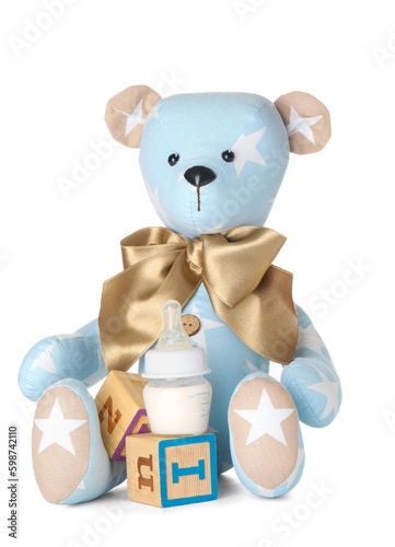 Teddy bear with bottle of m...