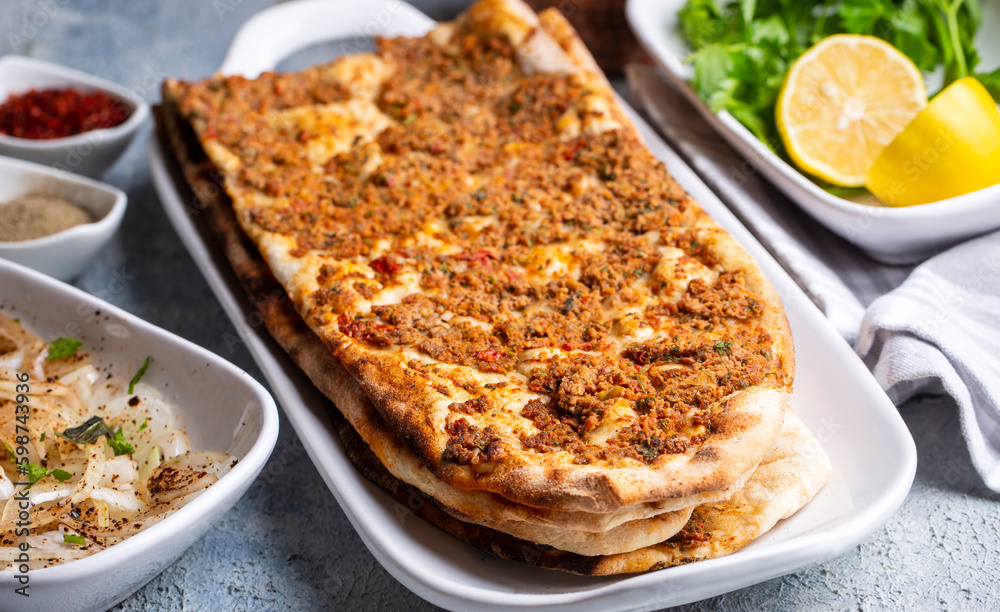 Turkish pide with minced meat, Turkish name; Kiymali Pide. Traditional Turkish cuisine. Turkish pizza Pita with meat.