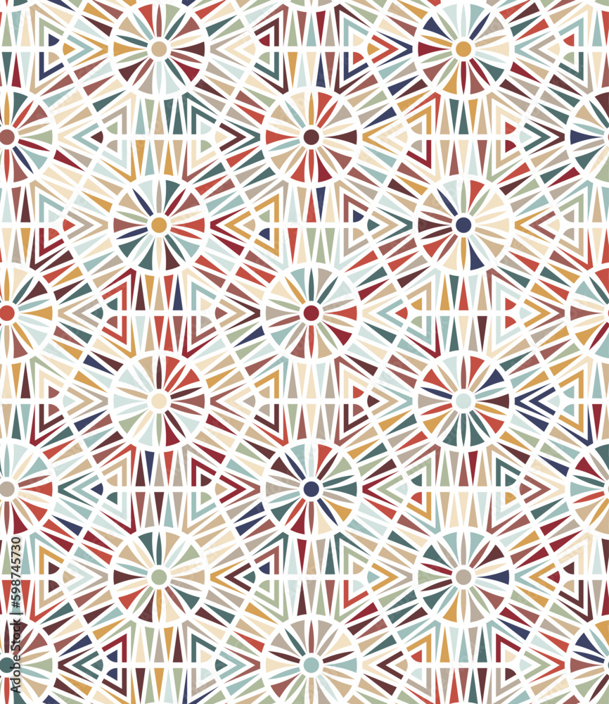 Small red, blue, yellow, and green triangles on a white background form an abstract geometric pattern with multicolored hexagons and circles in a tribal ethnic style. Seamless vector pattern.