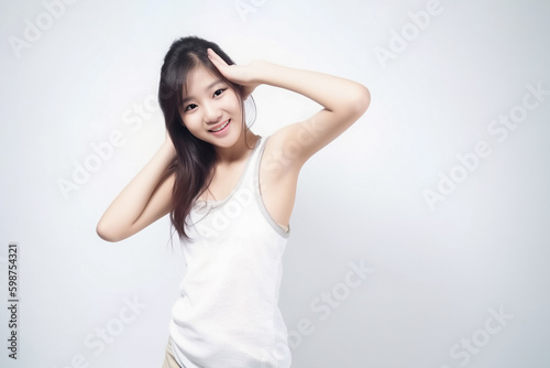Portrait of Cute Asian Woman, She raises her arm to show her Smooth armpit skin and looks at the camera on a White background in Studio light. generative AI.