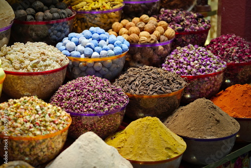 Fototapeta Variety of spices and dried herbs flowers on the arab street market stall