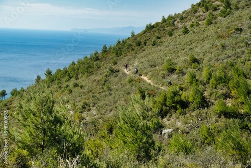 boys on mountain bikes on the hills of Varigotti during a summer day