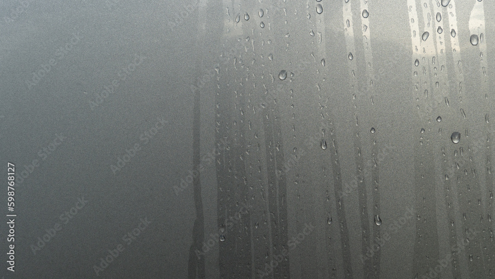 Abstract of Running path of dew drops. On surface gray color body of car. Abstract of Running path of dew drops. On surface gray color body of car.