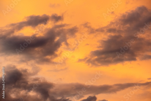 Panoramic view of sunset golden and blue sky nature background. Colorful dramatic sky with cloud at sunset.Sky background.Sky with clouds at sunset.