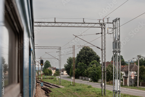 Decaying railway infrastructure seen from the window of an Electric suburban train, an EMU of Beovoz BG Voz service on a train, near Lazarevac, on a sbahn service in the suburbs of belgrade. photo