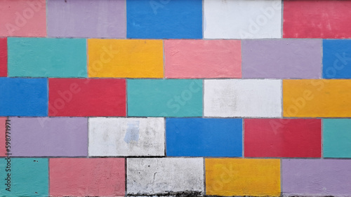 COLOURFUL WALL TILES DESIGN. Grunge style abstract background with a geometric design. brick wall painted in rainbow colors