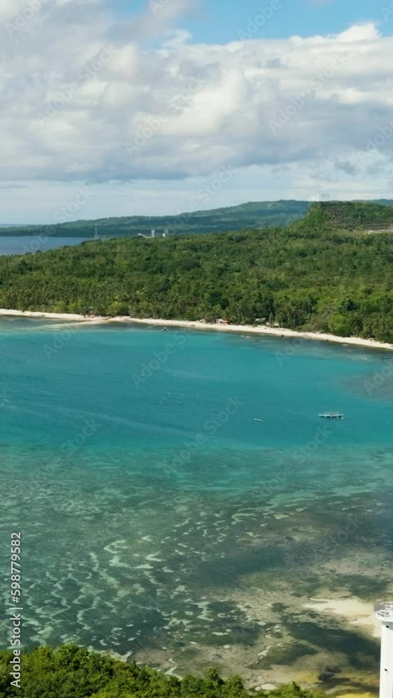 A beautiful coastal view with a floating boats of Tropical Island. Siquijor, Philippines. A beautiful coastal view with a floating boats of Tropical Island. Siquijor, Philippines.