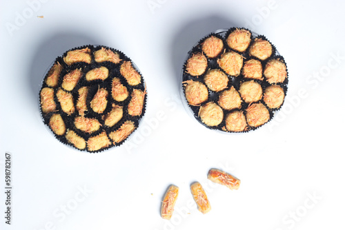 Castangle cheese or Kastengel Keju on dark background, This cookies is to celebrate Eid al Fitr or Idul Fitri.	 photo