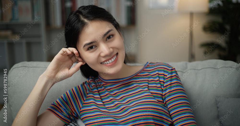 Portrait of young asian female smiling face and looking at camera Portrait of young asian female smiling face and looking at camera