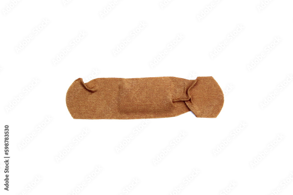 A crumpled adhesive plaster lies on a white background. A crumpled adhesive plaster lies on a white background.