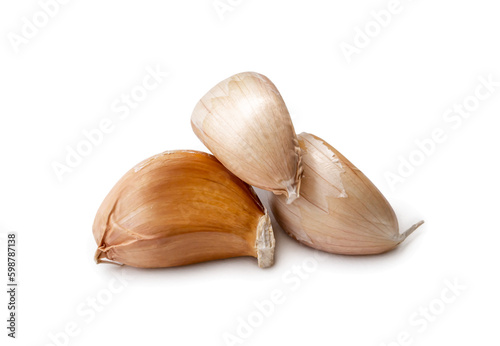 Fresh three garlic cloves in stack isolated on white background with clipping path in png file format