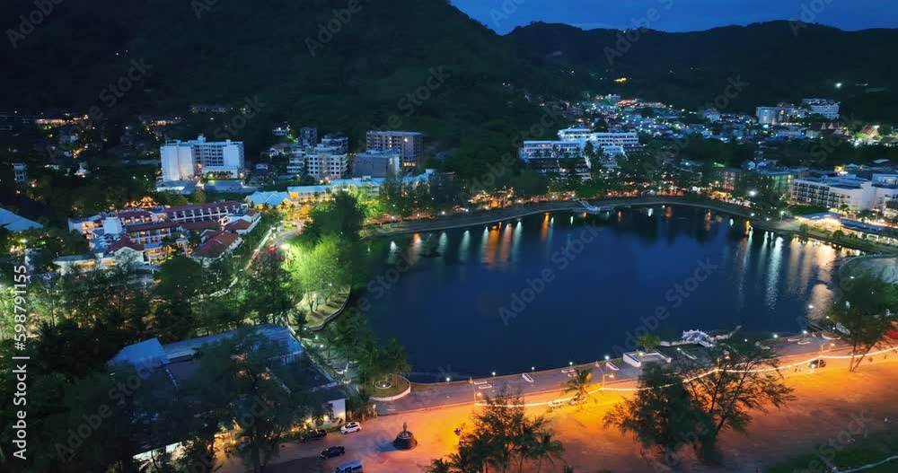 aerial view The light reflects of the water in the large lagoon at Karon Beach in twilight..The twinkling lights are spectacular and beautiful..beautiful lighting background.