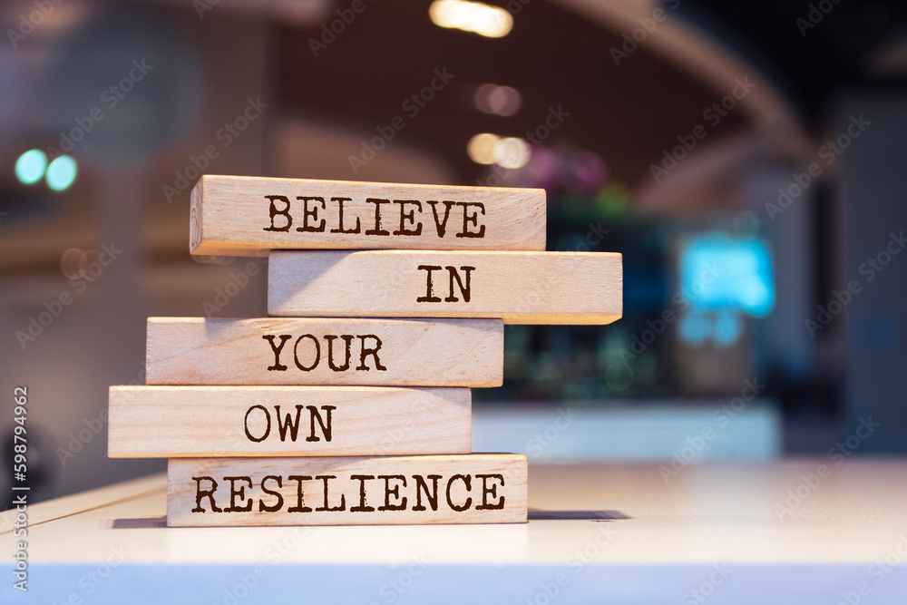 Wooden blocks with words 'Believe in your own resilience'.
