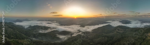 Panorama sunrise landscape under the beautiful cloud valley as the mist moves around the hill