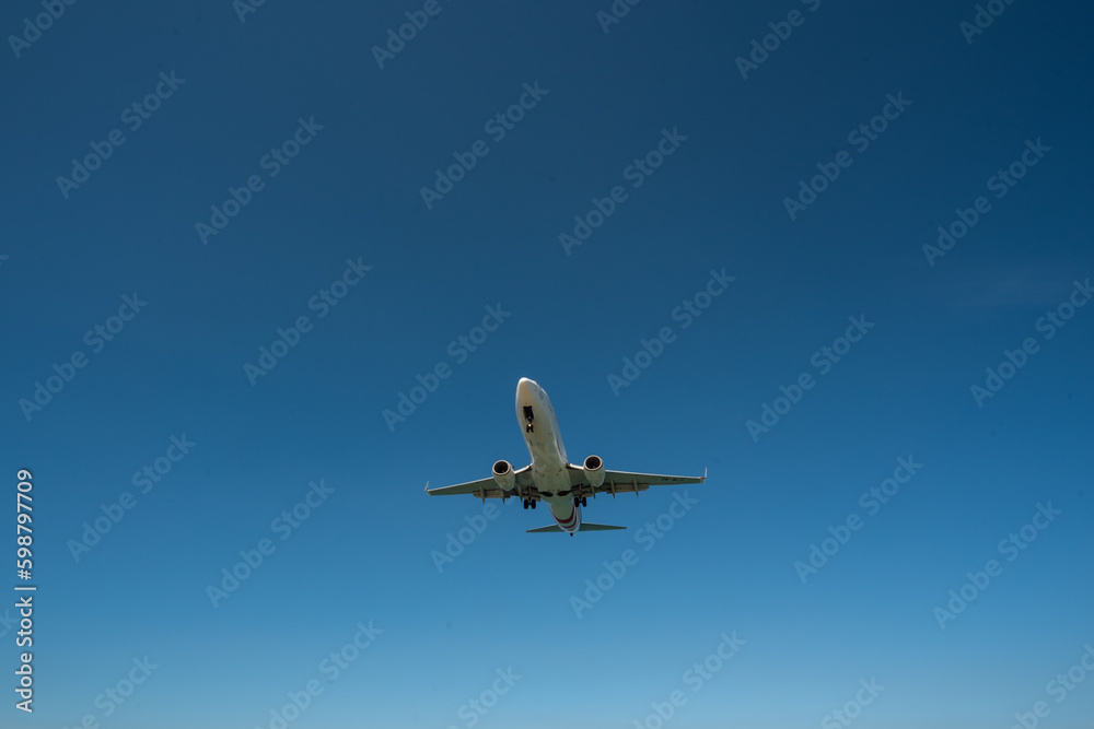 Airplane flying at sky, Airliner passing blue sky Airplane flying at sky, Airliner passing blue sky