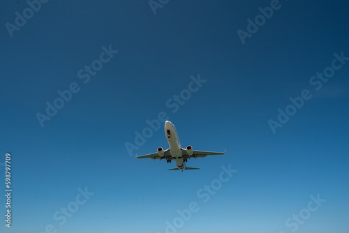 Airplane flying at sky, Airliner passing blue sky