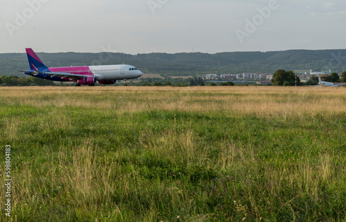 Arriving plane at the airport in the middle of the tourist season.