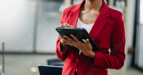 businesswoman hand using smart phone, tablet payments and holding credit card online shopping, omni channel, digital tablet docking keyboard computer