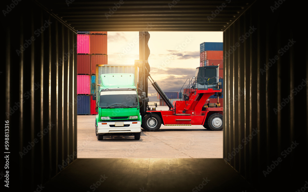 Inside View of Cargo Container. Crane Tractor Lifting up Cargo Containers. Handling of Logistics Transportation Industry. Cargo Container ships, Freight Trucks Import-Export, Distribution Warehouse.
