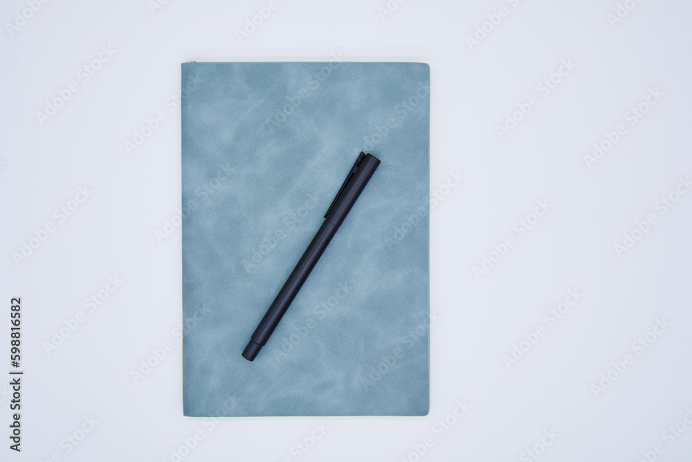 Pen and notebook on white background Pen and notebook on white background