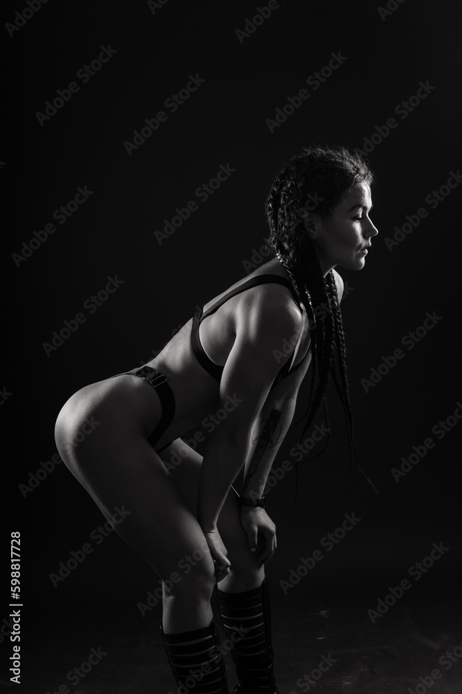 Perfect woman body on black background studio, sport muscles belly