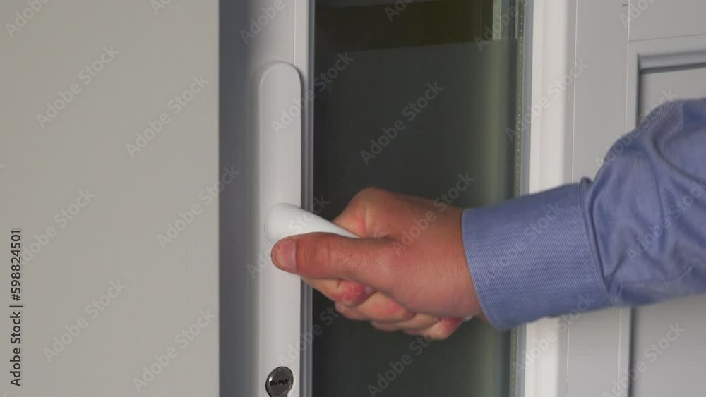 Man Trying To Open A Closed Door Office,a man's hand wants to open a plastic door, a closed door, the end of the working day Man Trying To Open A Closed Door Office,a man's hand wants to open a plastic door, a closed door, the end of the working day