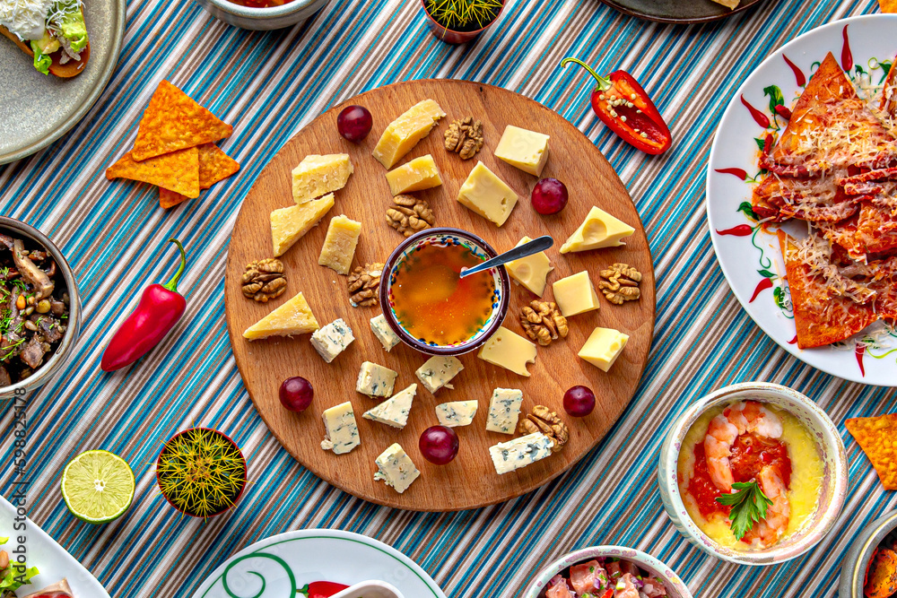 Traditional mexican food. Cheese plateau. Colorful Food Table Celebration Delicious Party Meal Concept. 