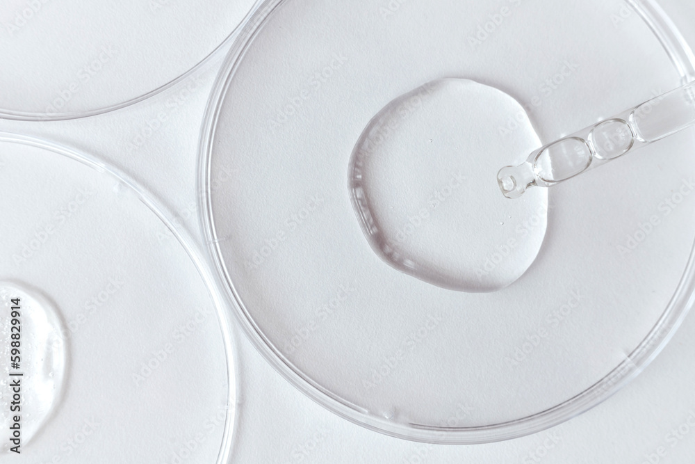 Pipette with Sample of Gels Cosmetic Product in Petri Dish on white background
