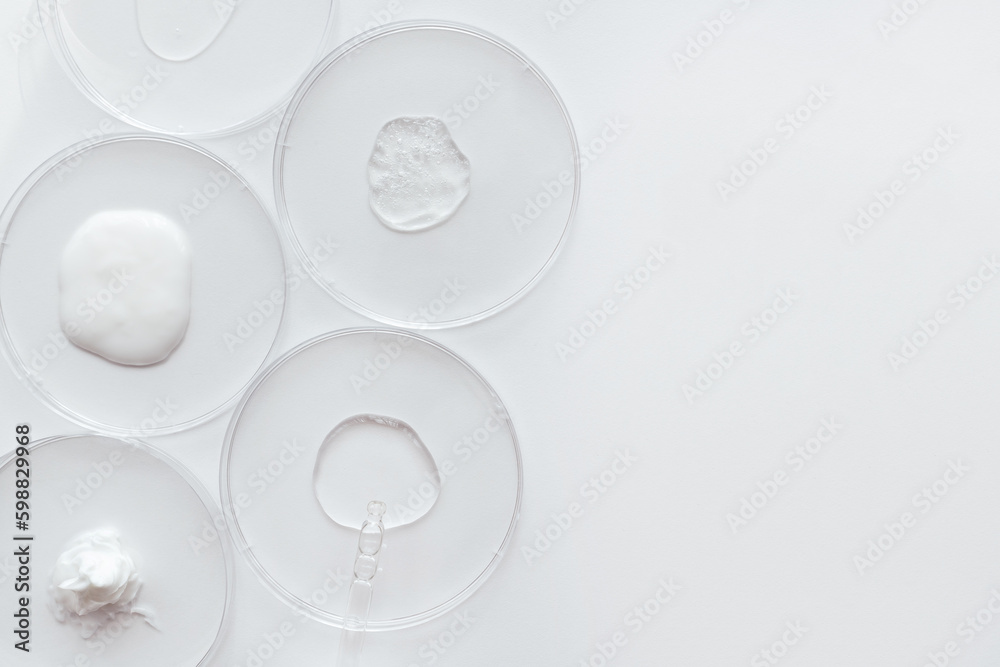 Pipette with Sample of Gels Cosmetic Product in Petri Dish on white background Pipette with Sample of Gels Cosmetic Product in Petri Dish on white background