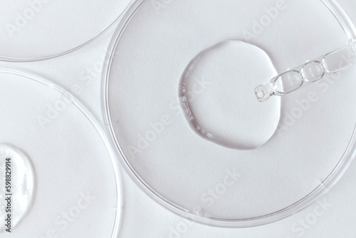 Obraz na płótnie Pipette with Sample of Gels Cosmetic Product in Petri Dish on white background w salonie
